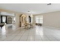 Bright dining room with tiled floors, a chandelier, and lots of natural light at 13054 Prairie Meadows Dr, Orlando, FL 32837