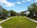 Beautiful community with a central green space, walkways, and well-maintained landscaping for a serene neighborhood feel at 14025 Hench Ln, Orlando, FL 32827