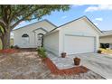 Charming single-Gathering home with well-maintained landscaping and a two-car garage at 1862 Spreakley Ct, Orlando, FL 32837