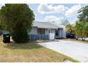 Single story home with a small, fenced front yard and a simple landscaping at 3154 Stonecastle Rd, Orlando, FL 32822