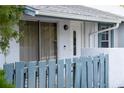 Close-up of the front entrance with a secure door, doorbell, and a small blue fence at 3154 Stonecastle Rd, Orlando, FL 32822