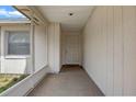 Covered front porch with door providing a sheltered entrance to the home at 3199 Tobago Ct, Apopka, FL 32703
