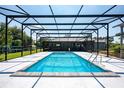 Screened in swimming pool with ladder and exterior view of home at 4170 Packard Ave, St Cloud, FL 34772