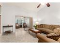 Cozy sunroom with neutral tones, comfortable seating, and views of the outdoors provides a serene retreat at 4232 Sandhurst Dr, Orlando, FL 32817
