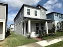 Charming two-story home with a covered porch and manicured landscaping at 4828 Abbeywood Aly, Winter Garden, FL 34787