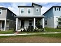 Charming two-story home with a covered porch and manicured landscaping at 4828 Abbeywood Aly, Winter Garden, FL 34787