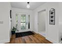 Bright foyer with wood flooring, a decorative glass window, and neutral wall paint at 105 Dublin Dr, Lake Mary, FL 32746