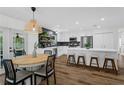Open-concept kitchen with stainless steel appliances, a center island, and a dining area at 105 Dublin Dr, Lake Mary, FL 32746