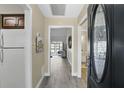 Inviting entryway with wood floors, leading to the living areas and a view of the home's interior at 1136 Villa Ln # 96, Apopka, FL 32712