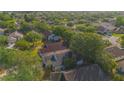Residential community featuring single Gathering homes, mature trees and common areas with lakes at 13216 Wild Duck Ct, Orlando, FL 32828