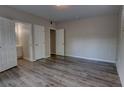 Spacious bedroom with a large closet and luxury vinyl plank flooring at 136 Country Club Dr, Sanford, FL 32771