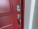 Close-up of the front door, featuring a modern digital keypad for enhanced security at 16927 Sw 25Th Terrace Rd, Ocala, FL 34473