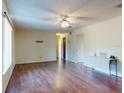 Bright living room with ceiling fan, wood flooring and neutral walls at 1872 N Akron Dr, Deltona, FL 32738