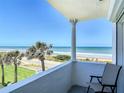 Balcony with ocean view, columns, and chair at 1926 Ocean Shore Blvd # 3120, Ormond Beach, FL 32176