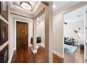 Inviting foyer with hardwood floors, decorative columns, and an open view into the living area at 220 S Summerlin Ave, Orlando, FL 32801