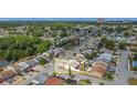 Aerial view of home, showcasing its location surrounded by lush trees and manicured lawns at 2803 Charing Cross Way, Orlando, FL 32837