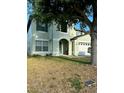 Lovely two-story house with well-maintained lawn and green accents at 2806 Polson Dr, Kissimmee, FL 34758