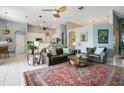 Spacious living area with vaulted ceilings, tile floors, and an open layout leading to the kitchen at 4219 Lillian Hall Ln, Orlando, FL 32812