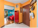 Bright entryway showcasing colorful walls, unique decor, and hardwood floors leading to a cozy living area at 516 Orange Dr # 22, Altamonte Springs, FL 32701