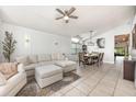 Open-concept living room with stylish decor, adjacent to the dining area at 525 Hardwood Cir, Orlando, FL 32828