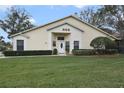 Inviting single-Gathering home with a manicured lawn and lush shrubbery enhancing its curb appeal at 688 W Cranes Cir, Altamonte Springs, FL 32701