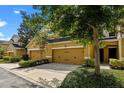Charming townhouse with two-car garage, lush front yard landscaping and inviting curb appeal at 8031 Enchantment Dr # Ge, Windermere, FL 34786