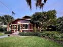 Charming bungalow with inviting front porch, mature landscaping, and craftsman architectural details at 806 E Amelia St, Orlando, FL 32803