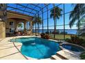 Screened in pool and jacuzzi area with beautiful lake views at 8250 Cherry Lake Rd, Groveland, FL 34736