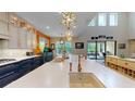 Bright kitchen featuring a large island with a sink, pendant lighting, and ample counter space at 8478 Elba Isle Ct, Windermere, FL 34786