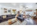 Comfortable living area with a large sofa, accent chairs, and plenty of natural light at 8619 Veridian Dr, Orlando, FL 32810