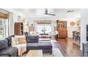 Bright and airy living room with stylish seating and a view into the dining area at 8619 Veridian Dr, Orlando, FL 32810