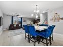 Open concept living space with tile flooring, dining table and comfortable furniture, ideal for relaxation at 9009 Savannah Julip Ln, Orlando, FL 32832