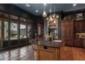 Well-appointed kitchen featuring sleek countertops, custom cabinetry, and an adjacent breakfast area at 9730 Lounsberry Cir, Golden Oak, FL 32836