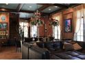 Spacious living area featuring sophisticated furnishings, hardwood floors, and abundant natural light at 9730 Lounsberry Cir, Golden Oak, FL 32836