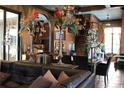 Expansive living room showcasing luxurious decor, rich wood accents, and an inviting atmosphere at 9730 Lounsberry Cir, Golden Oak, FL 32836