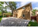 Large backyard featuring a paved patio area and pergola at 1130 Hardy Ave, Orlando, FL 32803