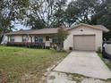 Inviting single story home with attached garage, landscaped yard, and updated exterior at 123 N High St, Lake Mary, FL 32746