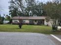Charming single story home with mature landscaping and attached garage at 123 N High St, Lake Mary, FL 32746