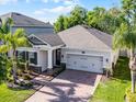 Beautiful home with a brick driveway and landscaping at 1232 Turnbridge Pl, Oviedo, FL 32765
