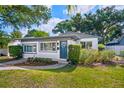 Well-maintained single-story home with a tidy front lawn and inviting entry at 1421 N Hampton Ave, Orlando, FL 32803