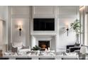 Elegant living room features a fireplace, stylish decor, and comfortable seating at 185 Sylvan Blvd, Winter Park, FL 32789