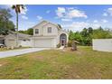 Beautiful two-story home with a spacious front yard, showcasing its well-maintained exterior at 232 Oxford Rd, Davenport, FL 33896