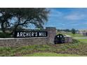 Stone monument sign marking the entrance to Archer's Mill community shows manicured landscaping at 3310 Arch Ave, Ormond Beach, FL 32174