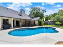 Beautiful backyard pool featuring a spa and a covered patio area, perfect for entertaining and relaxation at 370 Brushwood Ln, Winter Springs, FL 32708