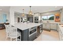 Beautiful kitchen with modern appliances, a large island, and ample storage space at 8988 Houston Pl # 303, Orlando, FL 32819