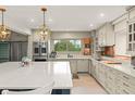 Spacious kitchen with custom cabinets, stainless steel appliances, and quartz countertops at 8988 Houston Pl # 303, Orlando, FL 32819
