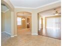 Open-concept living spaces with a combination of tile and hardwood flooring and neutral paint at 173 Donner Dr, Winter Garden, FL 34787