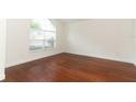 Bright living room with hardwood floors and large window letting in natural light at 1937 Crystal Downs Ct, Oviedo, FL 32765