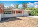 Inviting single-story home boasting a charming covered porch, brick accents, and an attached garage at 2631 Mcdonald Ter, Mount Dora, FL 32757