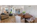 Bright living room with dining area and access to the backyard through sliding glass doors at 2681 Spider Lily Ct, Clermont, FL 34711
